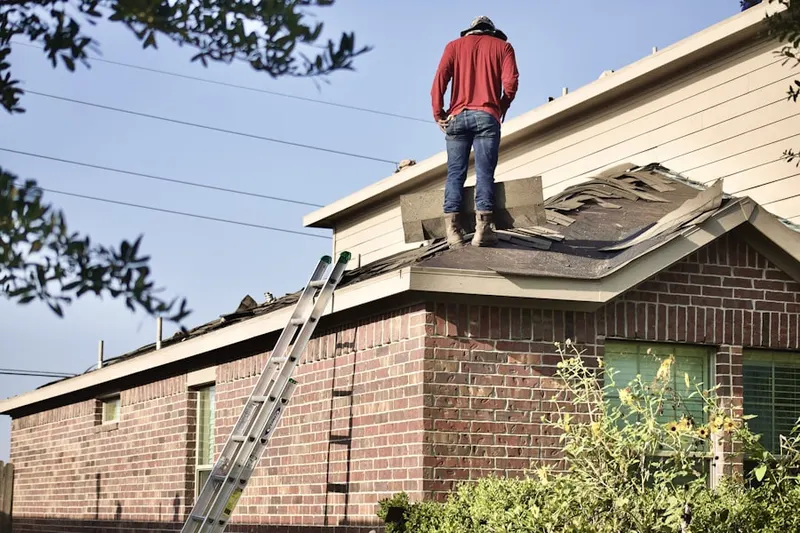 Professional roofer working on a residential roof in Cibolo
